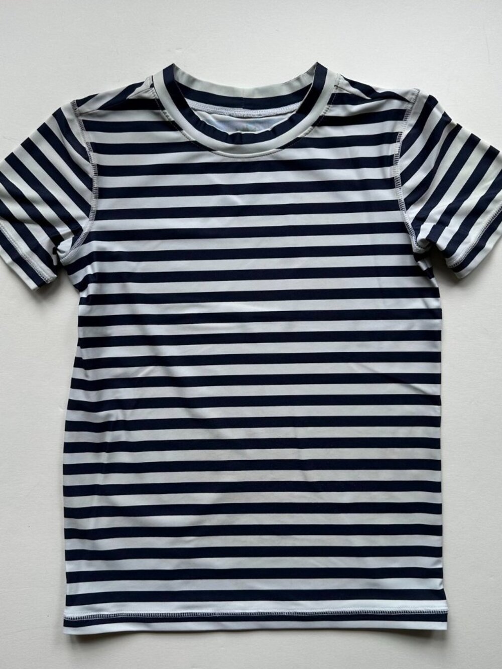 Navy blue and white striped short sleeve Primary youth rash guard